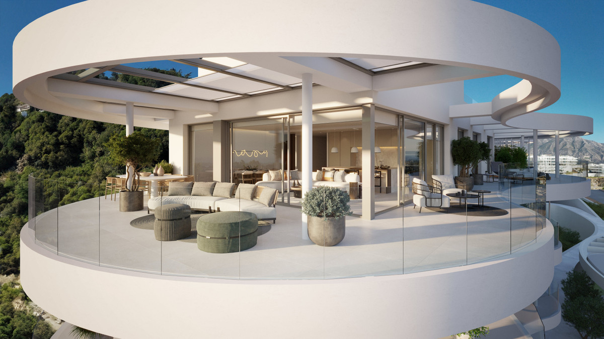 Spacious modern terrace with glass railings, offering panoramic views and stylish outdoor seating.