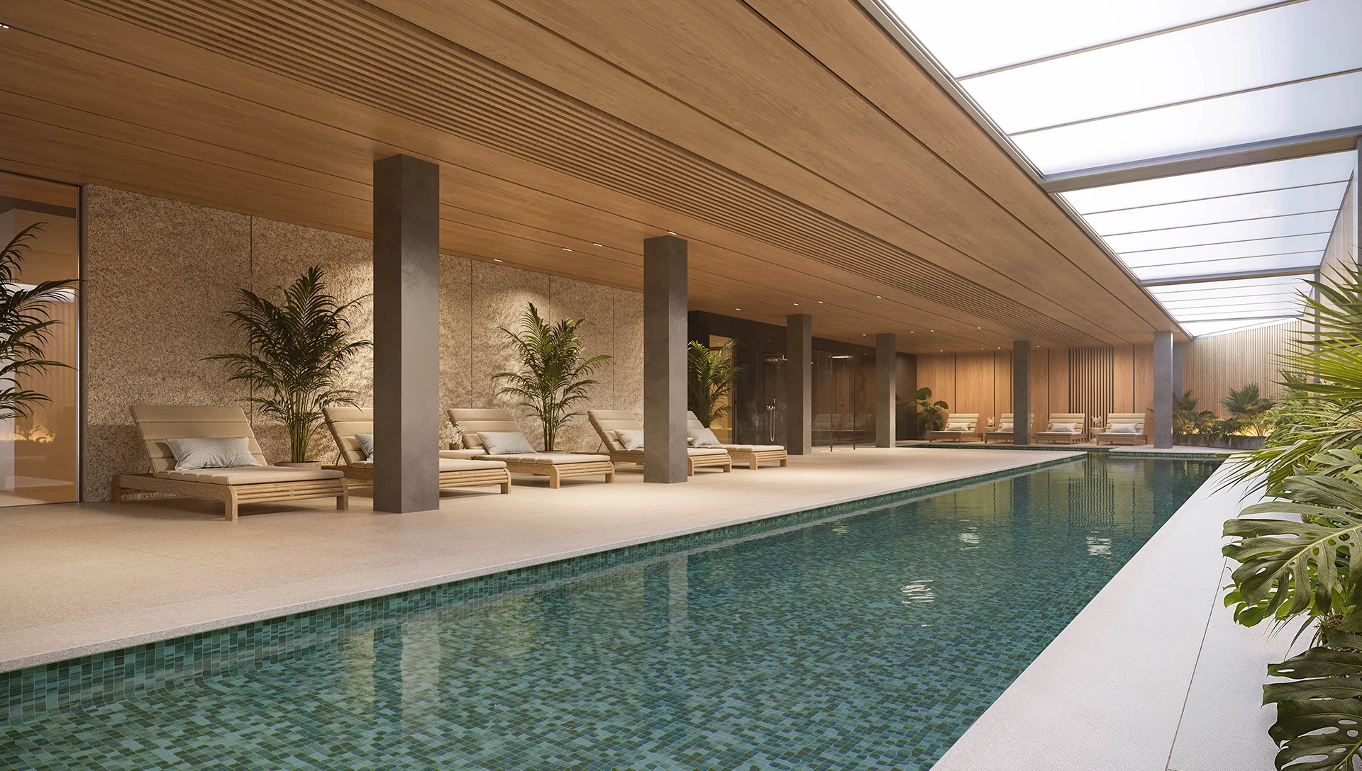 Indoor pool area with wooden accents and lounge chairs, featuring tropical plants and natural light from skylights.