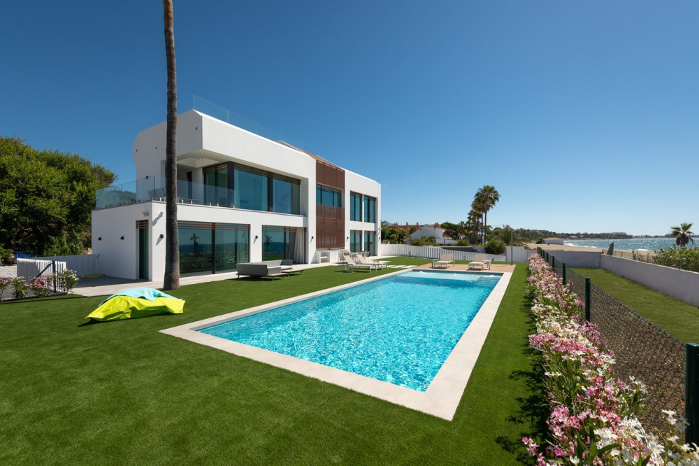 Stunning contemporary villa located front line beach on the New Golden Mile. Image 1