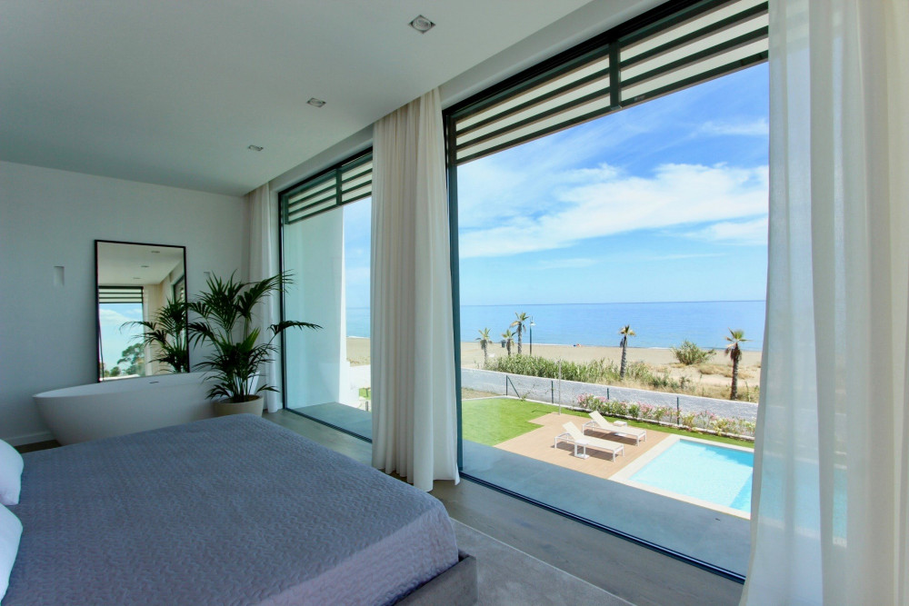 Stunning contemporary villa located front line beach on the New Golden Mile. Image 21